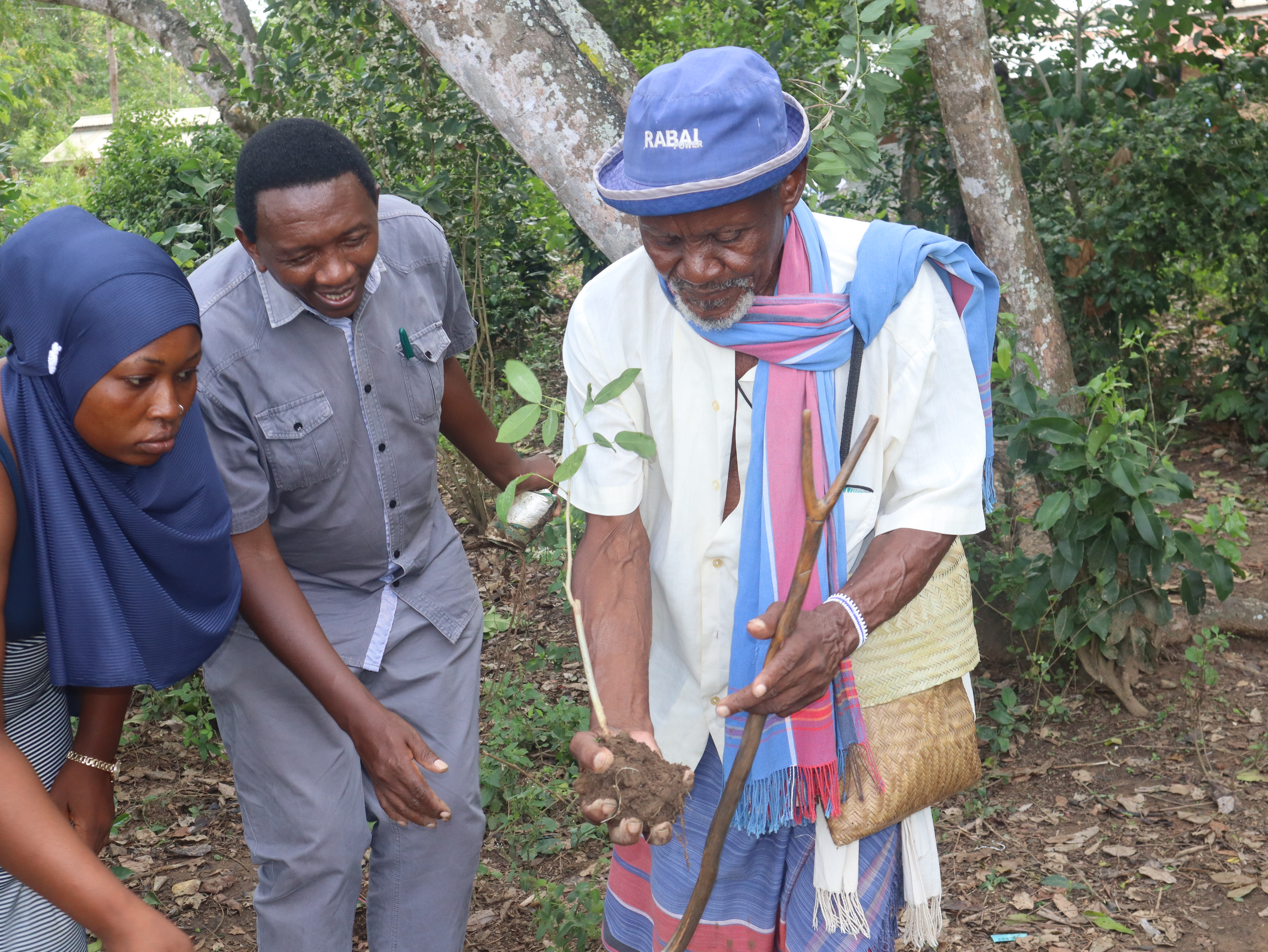 A Kaya Elder plants a seed of hope in Kaya Rabai, Kilif County.